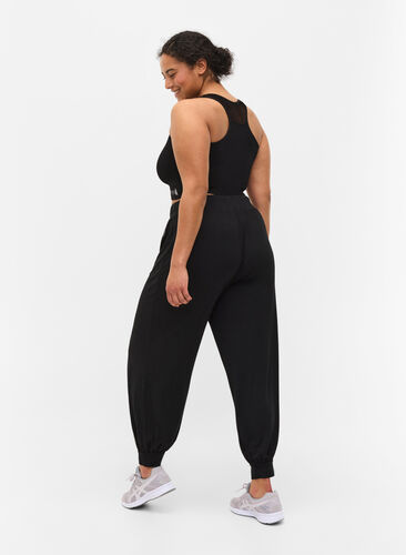 Pantalon d'exercice ample en viscose, Black, Model image number 0