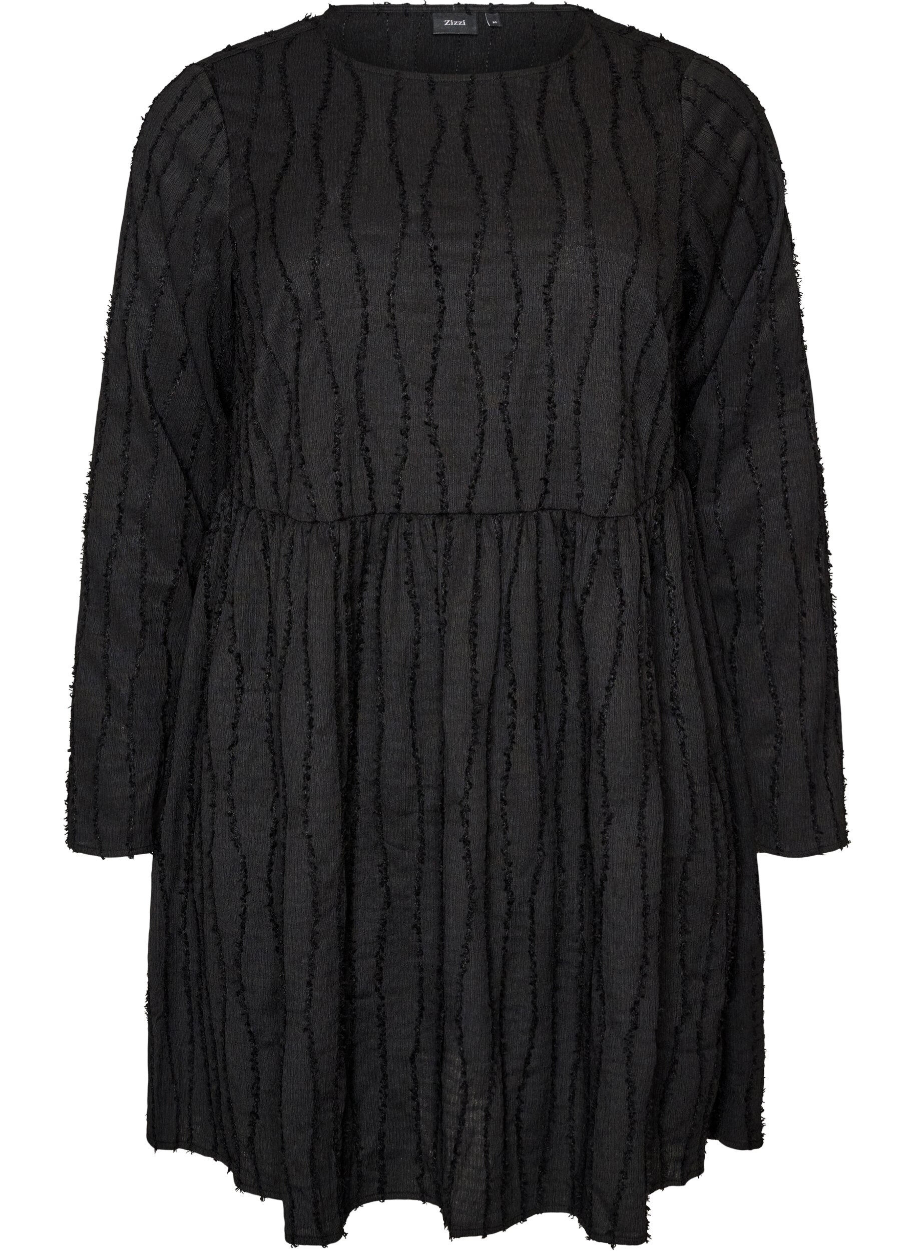 Korte jerseyjurk met een golvend textuurpatroon