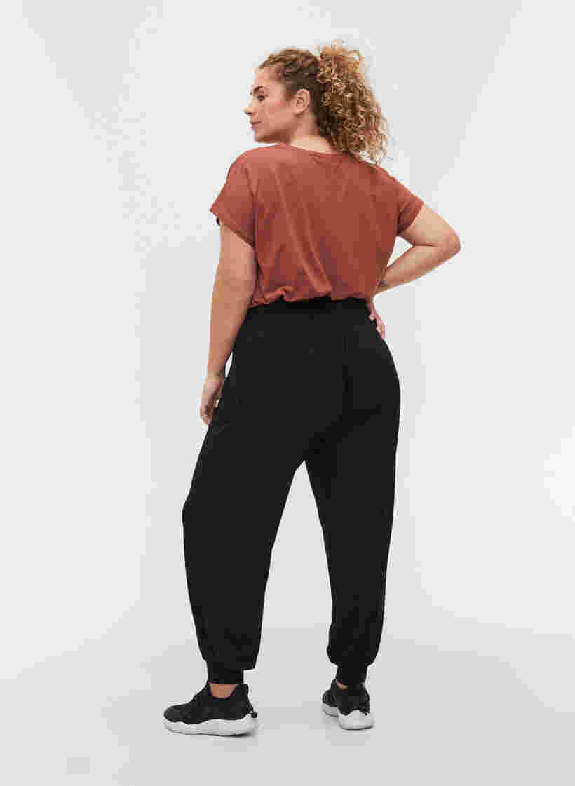 Pantalon d'entraînement ample en viscose, Black, Model image number 1