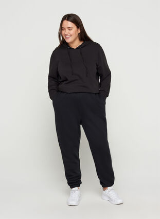 Pantalon de jogging ample avec poches, Black, Model image number 0