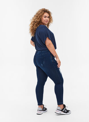 Super slim fit Amy jeans met slijtage, Dark blue denim, Model image number 1