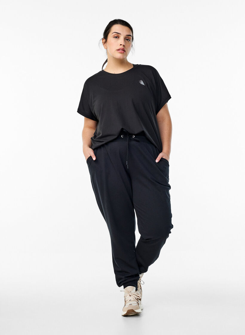 Losse trainingsbroek met zakken, Zwart, Model image number 1