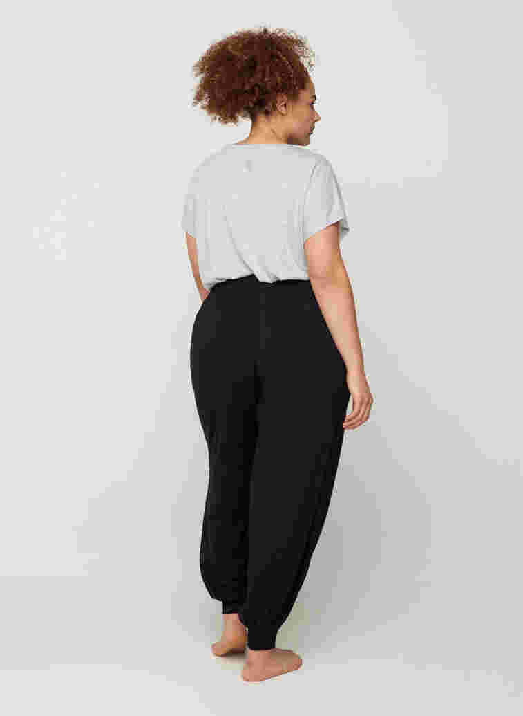 Pantalon ample en viscose avec poches, Black, Model image number 1