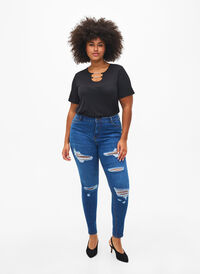 Slim fit jeans met slijtagedetails, Blue Denim, Model