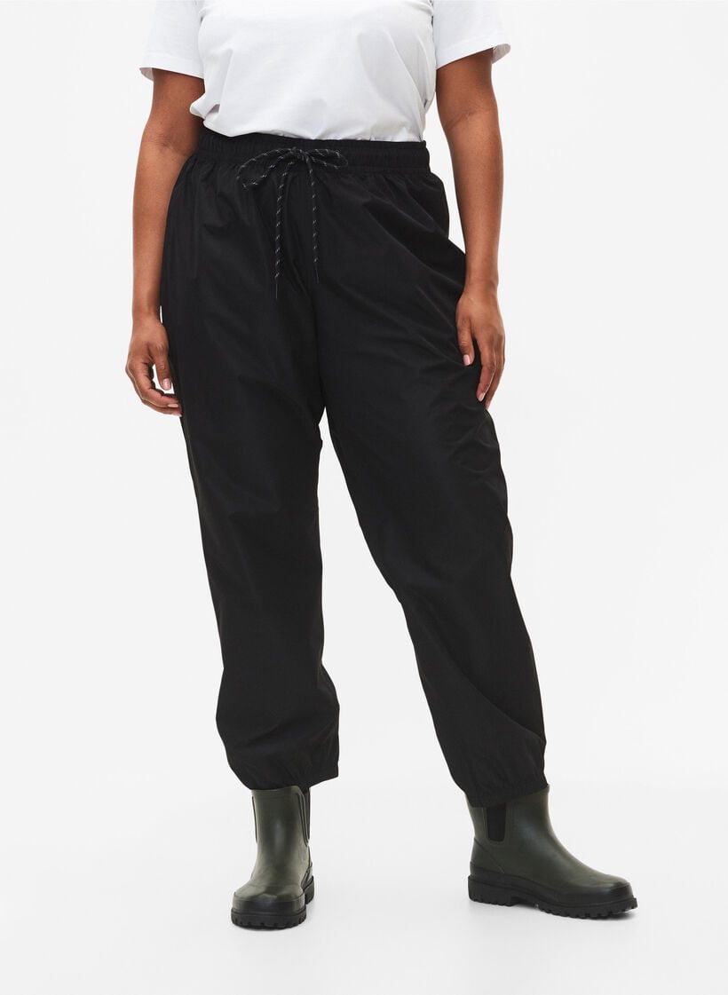 Regenbroek met elastiek en trekkoord, Zwart, Model image number 2