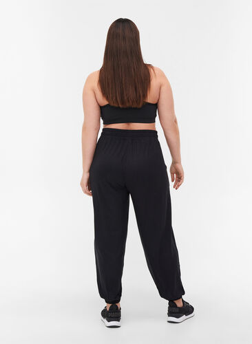 Pantalon d'entraînement ample avec poches en viscose, Black, Model image number 1