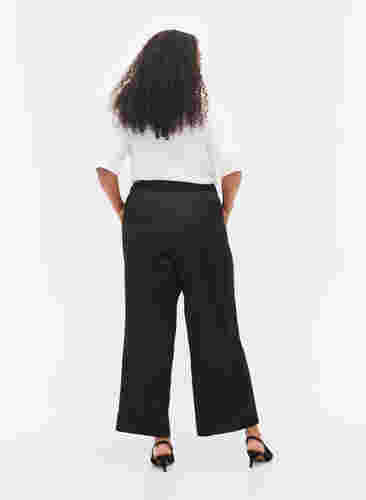 Pantalon ample avec poches et bord élastiqué, Black, Model image number 1