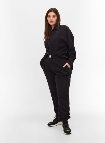 Pantalon ample en viscose avec bord élastiqué et poches, Black, Model image number 0