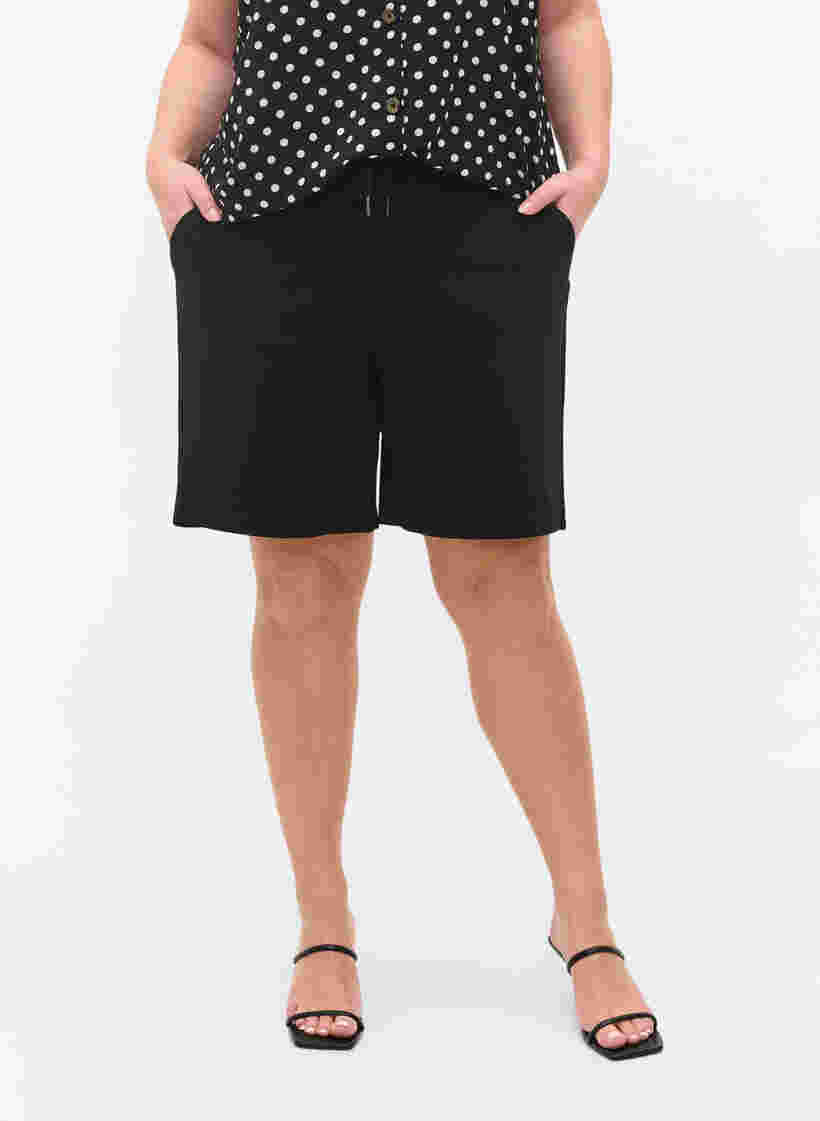 Short ample avec cordon de serrage et des poches, Black, Model image number 1
