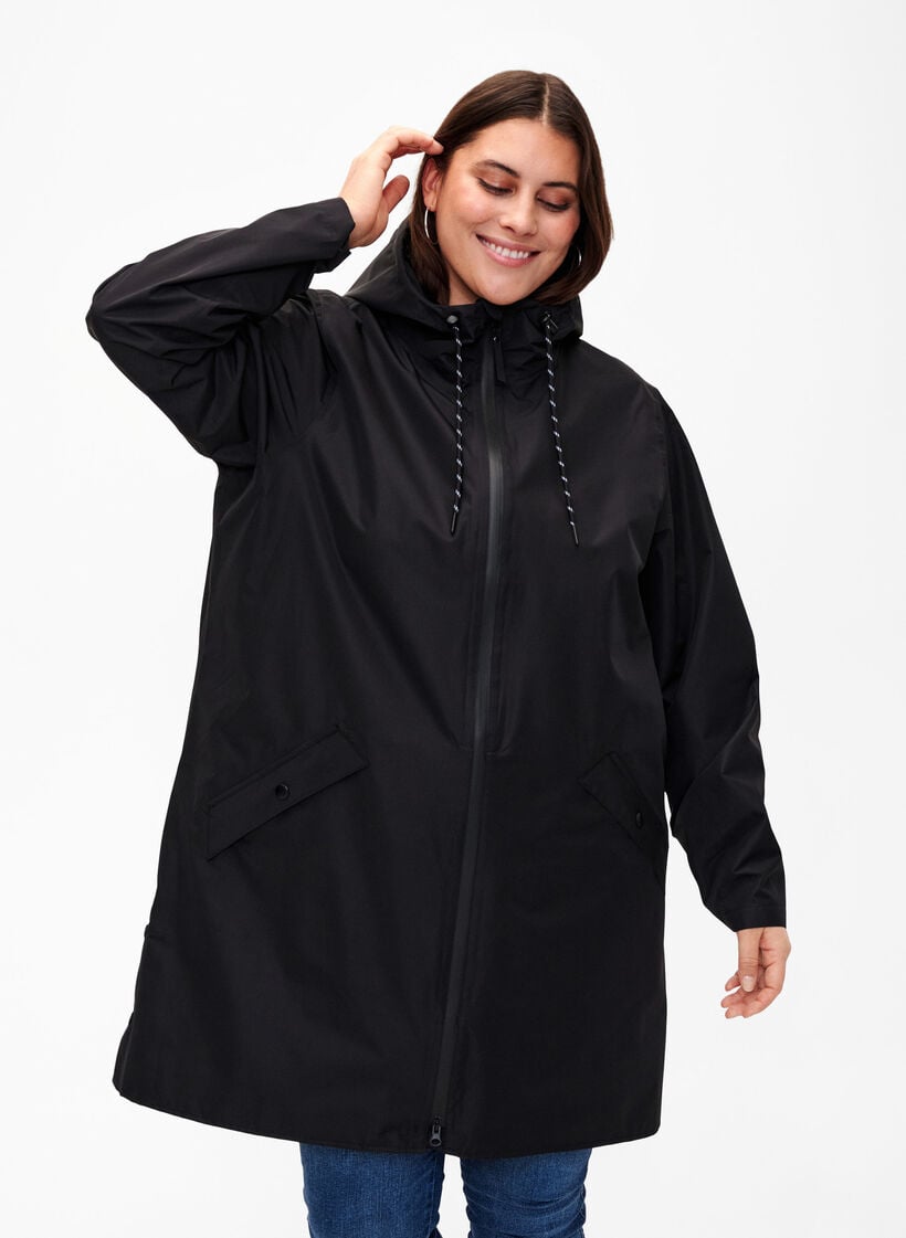 Regenjas met zakken en capuchon, Zwart, Model image number 0