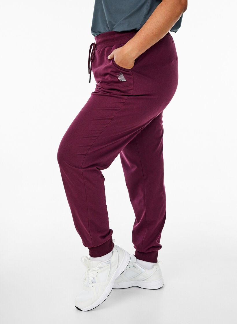 Losse trainingsbroek met zakken, Rood, Model image number 0