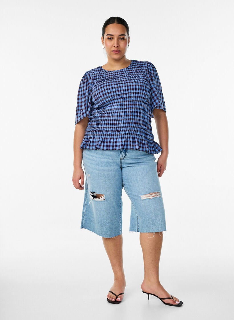 Gecropte jeans met een versleten look en rafelige randen, Blauw, Model