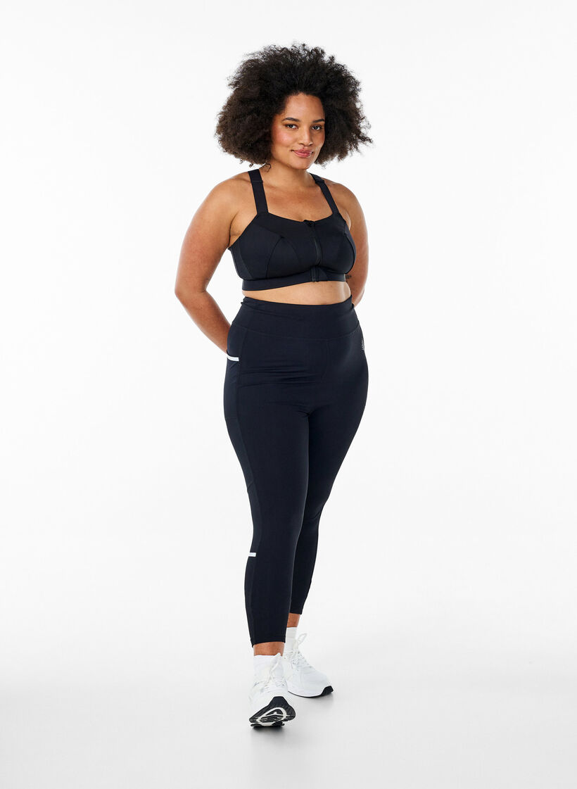 Leggings de course à compression légère et poches latérales, Noir, Model image number 1