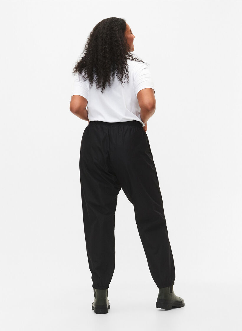 Pantalon de pluie avec élastique et cordon de serrage, Noir, Model image number 1