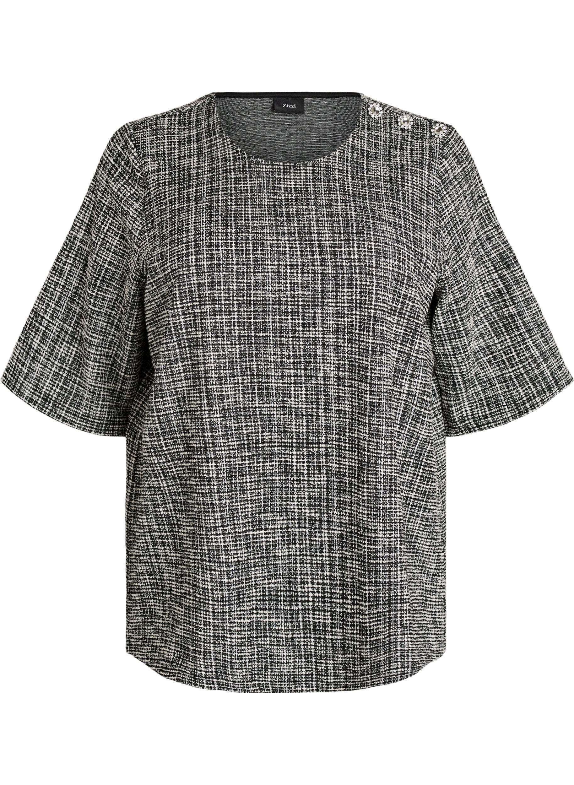 Blouse avec d&eacute;tail boutonn&eacute;